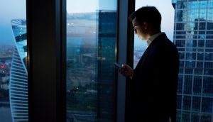 Business Man Working On His Mobile , Online Reputation Management